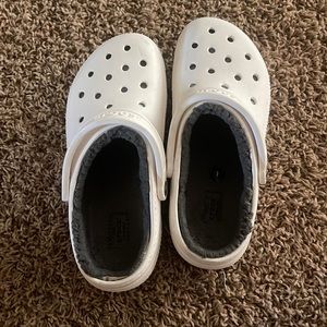 White crocs with furry gray liner